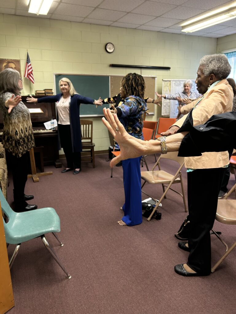 Karen Willis (on left) leading a Stretch and Praise session.